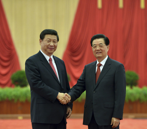 Chinese President Hu Jintao (R) shakes hands with newly-elected General Secretary of the Communist Party of China (CPC) Central Committee and Chairman of the CPC Central Military Commission Xi Jinping as they meet with delegates, special delegates and observers to the recently concluded 18th CPC National Congress, in Beijing, capital of China, Nov. 15, 2012. (Xinhua)