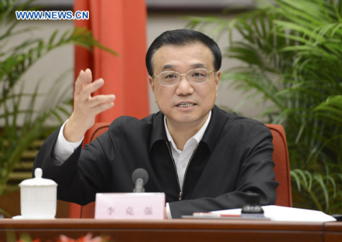 Chinese Vice Premier Li Keqiang, also a member of the Standing Committee of the Political Bureau of the Communist Party of China (CPC) Central Committee, presides over a conference on national comprehensive reform pilot areas in Beijing, capital of China, Nov. 21, 2012. (Xinhua/Xie Huanchi)