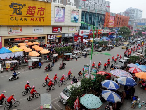 The wedding party cycle through Baise city, Guangxi province on Nov 25, 2012. Since National Day on Oct 1, bicycle weddings have become popular in the old revolutionary city. Young people have opted for two wheels over four for environmental reasons and t