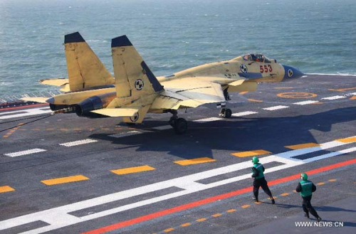 This undated photo shows a carrier-borne J-15 fighter jet landing on China's first aircraft carrier, the Liaoning. China has successfully conducted flight landing on its first aircraft carrier, the Liaoning. After its delivery to the People's Liberation Army (PLA) Navy on Sept. 25, the aircraft carrier has undergone a series of sailing and technological tests, including the flight of the carrier-borne J-15. Capabilities of the carrier platform and the J-15 have been tested, meeting all requirements and achieving good compatibility, the PLA Navy said. Designed by and made in China, the J-15 is able to carry multi-type anti-ship, air-to-air and air-to-ground missiles, as well as precision-guided bombs. The J-15 has comprehensive capabilities comparable to those of the Russian Su-33 jet and the U.S. F-18, military experts estimated. (Xinhua/Zha Chunming)