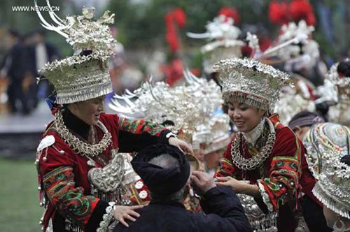 People of Miao ethnic group perform during the celebration of Miao's New Year in Leishan County, southwest China's Guizhou Province, Nov. 25, 2012. (Xinhua/Ou Dongqu) 