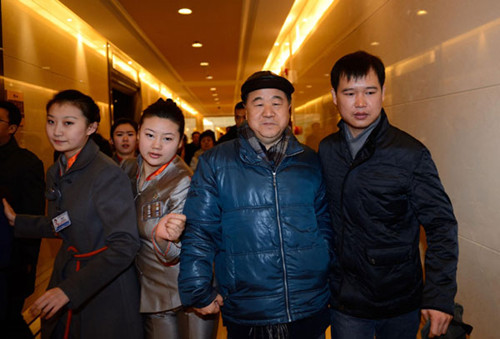 Mo Yan (2nd R), this year's winner of the Nobel Prize for Literature, arrives at the Beijing Capital International Airport in Beijing, as he is to leave for Sweden to accept the award, Dec 5, 2012. [Photo/Xinhua]