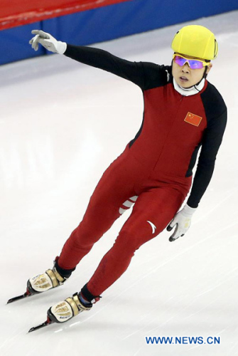 Wang Meng of China celebrates victory after the women's 500m final during the ISU Short Track World Cup speed skating competition in Shanghai, China, on Dec. 9, 2012. Wang won the gold medal with a time of 43.743 seconds.(Xinhua/Fan Jun)