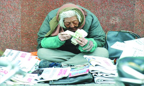 Homeless people wear thick jackets and find shelter in underpasses to escape winter.