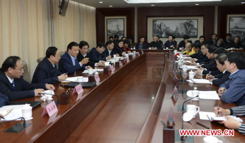 Liu Yunshan (3rd L), a member of the Standing Committee of the Political Bureau of the Communist Party of China (CPC) Central Committee, speaks during a symposium attended by officials and citizen members of Beijing's enterprises, villages and universities, in Beijing, capital of China, Dec. 10, 2012. At the symposium, Liu called for tenets of the 18th Party Congress to be implemented thoroughly in work, study and words. (Xinhua/Xie Huanchi)