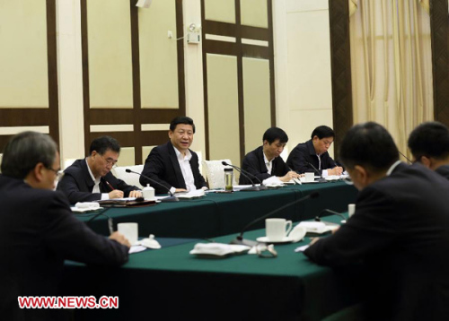 Xi Jinping (3rd L), general secretary of the Communist Party of China (CPC) Central Committee and chairman of the CPC Central Military Commission (CMC), addresses a meeting held with government officials and entrepreneurs in Guangzhou, capital of south China's Guangdong Province, Dec. 9, 2012. (Xinhua/Lan Hongguang)