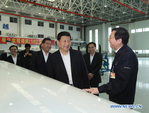 Photo released on Dec. 11, 2012 shows Xi Jinping (3rd R), general secretary of the Communist Party of China (CPC) Central Committee and chairman of the CPC Central Military Commission (CMC), visits an assembly workshop at the Zhuhai base of China Aviation Industry General Aircraft Co., Ltd. (CAIGA) in Zhuhai, south China's Guangdong Province. Xi made an inspection tour in Guangdong from Dec. 7 to 11. (Xinhua/Lan Hongguang)