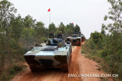 PLA), which was praised as land tiger, sea dragon and air eagle, carried out a series of amphibious armored training at the end of the year 2012 so as to solve the bottleneck problems in assessment. The photo shows the splendid moment of training. (China Military Online/Li Tang)