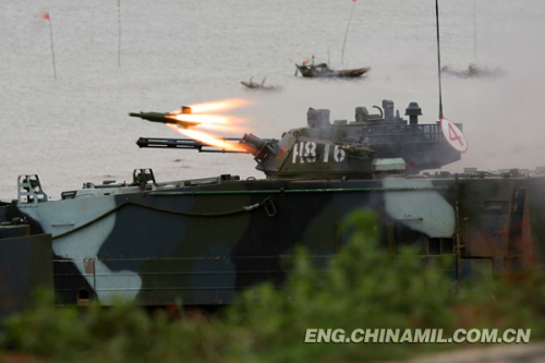 A brigade of the Marine Corps under the Navy of the Chinese Peoples Liberation Army (PLA), which was praised as land tiger, sea dragon and air eagle, carried out a series of amphibious armored training at the end of the year 2012 so as to solve the bottleneck problems in assessment. The photo shows the splendid moment of training. (China Military Online/Li Tang)