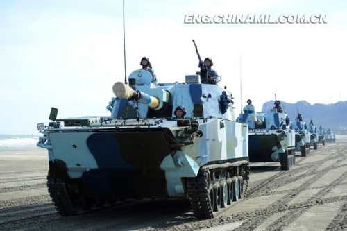 A brigade of the Marine Corps under the Navy of the Chinese Peoples Liberation Army (PLA), which was praised as land tiger, sea dragon and air eagle, carried out a series of amphibious armored training at the end of the year 2012 so as to solve the bottleneck problems in assessment. The photo shows the splendid moment of training. (China Military Online/Li Tang)