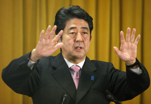 Liberal Democratic Party chief Shinzo Abe says at a news conference in Tokyo on Monday that he will not compromise on territorial issues. Abe is set to become Japan's next prime minister following his party's election victory on Sunday. Toru Hanai / Reuters