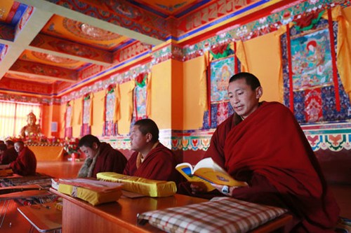 Monks chanting sutras in the Changlie Monastery in Barkam county, Aba prefecture.