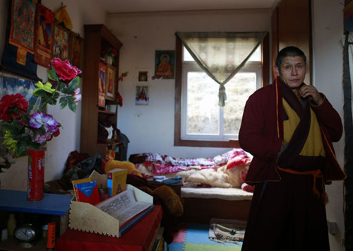 Asi, a 49-year-old monk, in his room in Changlie Monastery in Barkam county, Aba prefecture.