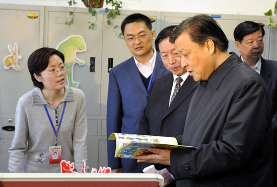 In this file photo taken on March 22, 2009, Liu Yunshan (R, front), then a member of the Political Bureau of the Communist Party of China (CPC) Central Committee, also a member of the Secretariat of the CPC Central Committee and head of the Publicity Department of the CPC Central Committee, learns about the operating status of publishers after restructuring during an investigation and research tour at the Shandong Publishing Group. (Xinhua/Zhu Zheng)