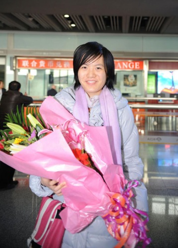 Hou Yifan arrives in Beijing after a historical victory over Hungarian Judit Polgar at the 10th Gibraltar Chess Festival, Feb 5, 2012. [Photo/Xinhua]