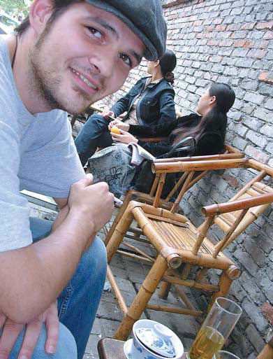 Sascha Matuszak relaxes at teatime in a small alley in Chengdu.