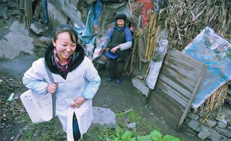 Zhong Jing, 30, a village doctor from Guizhou province pays a visit to a patient in Longhe village in Guangxi Zhuang autonomous region. She recently won an award as one of the most-respected village doctors. Ou Dongqu / Xinhua 