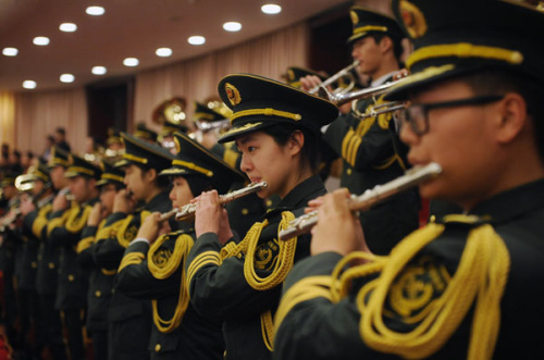 A PLA brass band performs at the opening of the fi rst session of the 14th Shanghai Municipal Peoples Congress on Sunday. The city is expected to attract another 150 regional headquarters of foreign multinational corporations by 2020, 37 percent more than the current 403. CAO LEI / FOR CHINA DAILY 