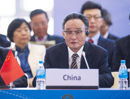 Wu Bangguo, chairman of the Standing Committee of the National People's Congress of China, delivers a keynote speech during the first plenary session of the 21st annual meeting of the Asia-Pacific Parliamentary Forum (APPF) in Vladivostok, Russia, Jan. 28, 2013. (Xinhua/Wang Ye)