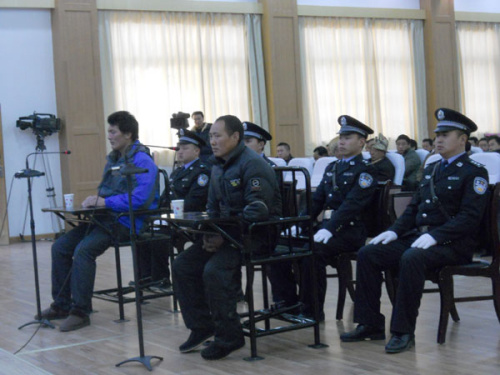 Lorang Konchok (right) and his nephew Lorang Tsering stand trial on Saturday over inciting self-immolation. [Photos by Huang Zhiling/www.chinadaily.com.cn]