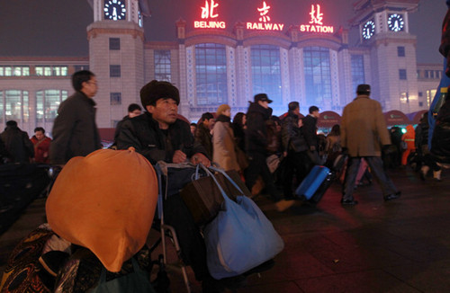 The Beijing Railway Station is one of the busiest places in China during the world's biggest travel rush. [Cui Meng / China Daily]