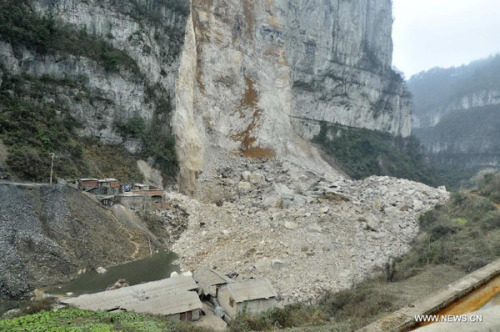 The site of a landslide is seen in Longchang Township in the city of Kaili, southwest China's Guizhou Province, Feb. 18, 2013. Initial investigation has found that five people, including two children, were buried after a landslide hit southwest China's Guizhou Province on Monday morning. The landslide happened around 11 a.m. in Longchang Township, burying six work sheds. (Xinhua/Xu Peiliang)