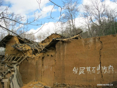 Photo taken on Feb. 19, 2013 shows a house destroyed by an earthquake in Qiaojia County of Zhaotong City in southwest China's Yunnan Province. Two people were injured when a 4.9-magnitude quake jolted the border area of southwest China's Sichuan and Yunna