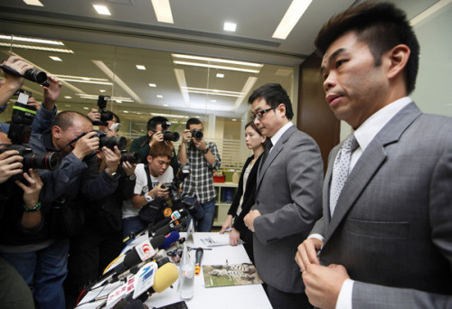 Officials from the Kuoni Travel Group, organizers of the Luxor trip for the Hong Kong tourists, attend a news conference in Hong Kong on Tuesday. [Photo by Kin Cheung / Associated Press]