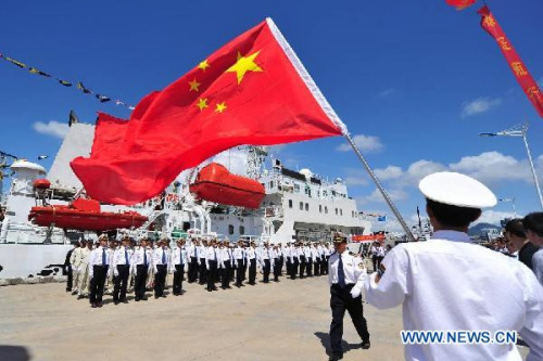 Marine patrol staff members get ready to conduct a coast guard mission at the port of Sanya, south China's Hainan Province, Feb. 28, 2013. A formation of three marine patrol ships Haixun 21, Haixun 31 and Haixun 166 started their coast guard mission in South China Sea on Thursday, a second one by the national Maritime Safety Administration at this water area in 2013. The first mission was conducted from Jan. 15, 2013 to Jan. 17, 2013. (Xinhua/Hou Jiansen)