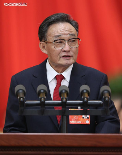 Wu Bangguo delivers a work report of the Standing Committee of the National People's Congress (NPC) during the second plenary meeting of the first session of the 12th NPC at the Great Hall of the People in Beijing, capital of China, March 8, 2013. (Xinhua/Pang Xinglei)