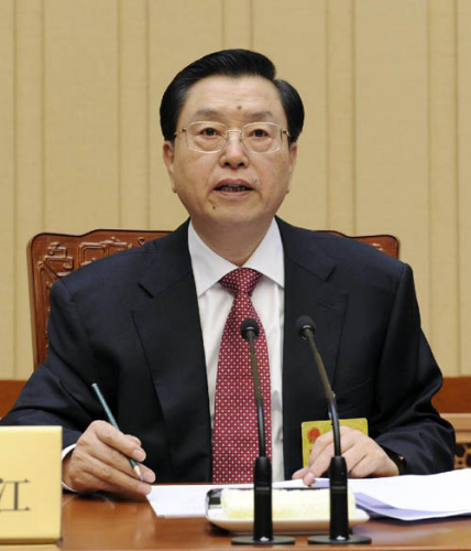 Zhang Dejiang, chairman of the Standing Committee of China's National People's Congress (NPC), presides over the first meeting of the 12th NPC Standing Committee in Beijing, capital of China, March 19, 2013. (Xinhua/Rao Aimin)