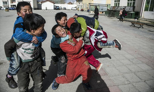 Students of a primary school in Aba play during morning break. 