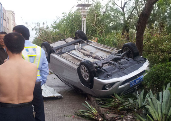 An overturned car after a storm at downtown Dongguan on Wednesday.Wang Junwei / Yangcheng Evening News