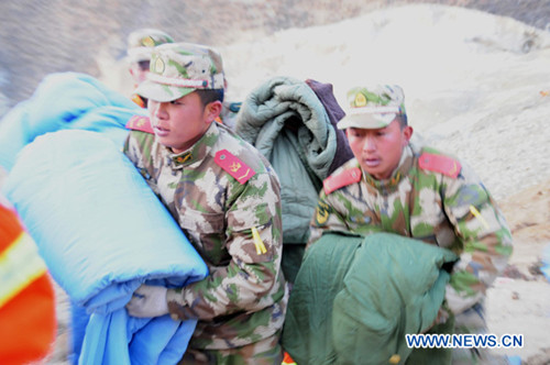 Rescuers work at the accident site after a major landslide hit a mining area of Tibet Huatailong Mining Development Co. Ltd, a subsidiary of the China National Gold Group Corporation, in Maizhokunggar County of Lhasa. (Xinhua)