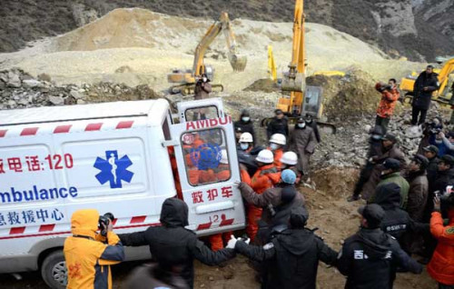 Firefighters carry bodies of two miners at the site where a large-scale landslide hit a mining area in Maizhokunggar County of Lhasa, southwest China's Tibet Autonomous Region, March 30, 2013.(Xinhua/Purbu Zhaxi) 