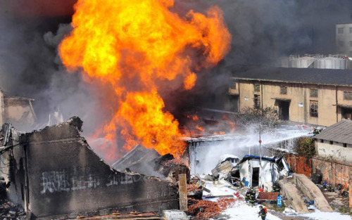 Firefighters work at the accident site after an explosion ripped through a warehouse of a chemical factory in the Dongxihu District of Wuhan, capital city of central China's Hubei Province, April 13, 2013. The casualties were unknown so far. [Photo/Xinhua