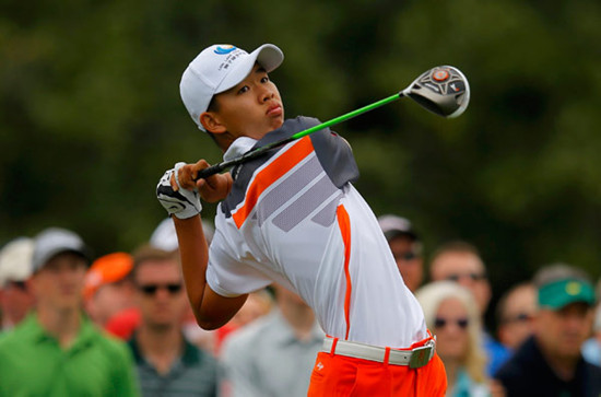 Amateur Guan Tianlang hits his tee shot on the 10th hole during the final round of play at the 2013 Masters. Brian Snyder / Reuters