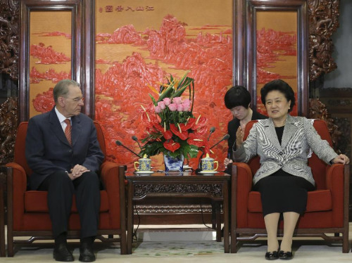 Chinese Vice Premier Liu Yandong (R) meets with International Olympic Committee President Jacques Rogge in Beijing, capital of China, April 22, 2013. (Xinhua/Ding Lin)