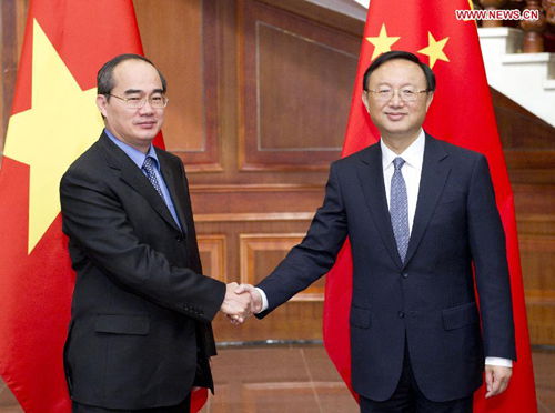 China's State Councilor Yang Jiechi (R) shakes hands with Vietnamese Deputy Prime Minister Nguyen Thien Nhan during the sixth meeting of the China-Vietnam steering committee on cooperation in Beijing, capital of China, May 11, 2013. (Xinhua/Huang Jingwen)