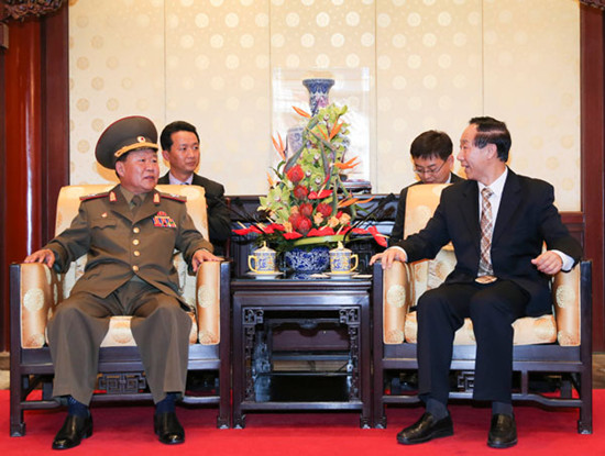 Wang Jiarui (right), the head of the Chinese leadership's international affairs office, meets with DPRKs Vice-Marshal Choe Ryong-hae, a senior Workers Party official and the militarys top political officer, in Beijing on Wednesday. Ding Lin / Xinhua