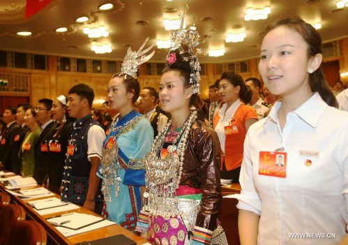 Representatives sing the national anthem during the opening ceremony of the 17th national congress of the Communist Youth League of China (CYLC) in Beijing, capital of China, June 17, 2013. Founded in 1922, the CYLC is a mass youth organization under the leadership of the Communist Party of China. (Xinhua/Wang Shen) 