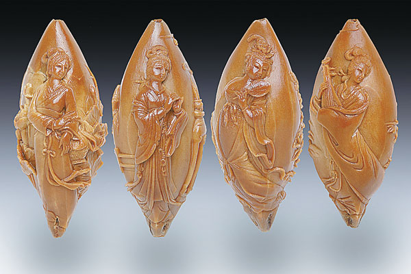 Four Ancient Beauties kernel carving by Lu Xiaoqin. Provided To China Daily