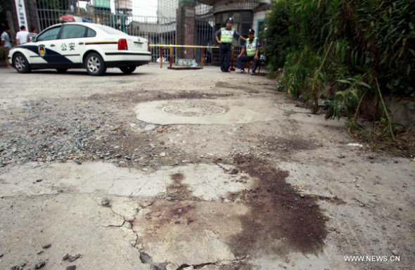 Bloodstain is seen at the murder site at a chemical factory in Baoshan District, east China's Shanghai Municipality, June 23, 2013. Police arrested late Saturday a 62-year-old man, surnamed Fan, who murdered six people, including four colleagues, a driver and a barracks guard in Shanghai. (Xinhua/Ding Ting)