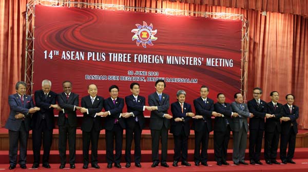 Top diplomats pose for a photo during the 14th ASEAN Plus Three Foreign Ministers' Meeting in Brunei's capital Bandar Seri Begawan on Sunday. Jin Yi / Xinhua 