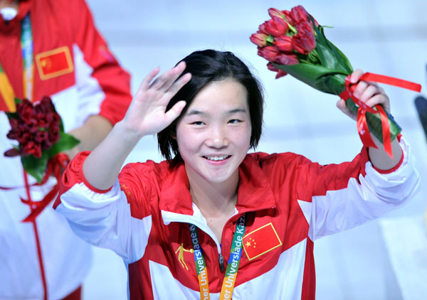 Zheng Shuangxue of China celebrates after winning the women's 3-meter springboard title at the Kazan Universiade in Kazan, Russia, July 10, 2013. [Photo/Xinhua]