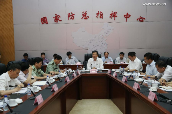 Chinese Vice Premier Wang Yang (C), also the chief commander of the State Flood Control and Drought Relief Headquarters (SFCDRH), presides over a plenary meeting of the SFCDRH in Beijing, capital of China, July 15, 2013. (Xinhua/Liu Weibing)