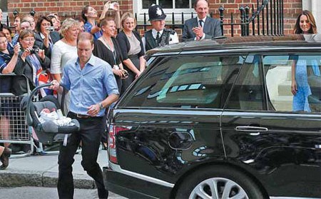 Britain's Prince William (left) and his wife, Catherine, Duchess of Cambridge, leave with their baby son from the Lindo Wing of St. Mary's Hospital in central London on Tuesday. Kate gave birth to their first child, who is third in line to the British throne, on Monday afternoon, ending weeks of anticipation about the arrival of the royal baby. Suzanne Plunkett / Reuters