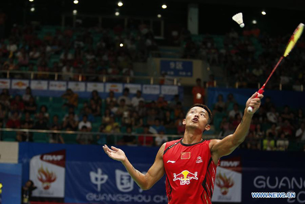 Lin Dan of China competes during men's single match against Chen Long of China at the 2013 BWF World Championships in Guangzhou, capital of south China's Guangdong Province, Aug. 9, 2013. Lin Dan won 2-0. (Xinhua/Bai Xuefei)