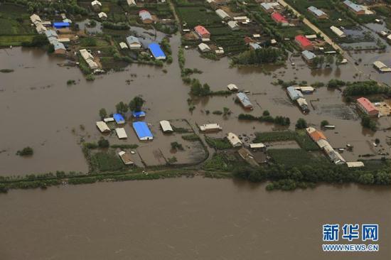 Continuous rain has swollen the Nenjiang River, in what locals are calling the worst floods in 15 years.