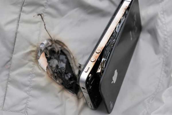 An iPhone 4 exploded while it was plugged into a factory charger and burned a vest that it was resting on in Zhuzhou, Hunan province, on Wednesday. Provided to China Daily